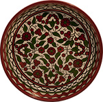 Terra Rossa - Red and green bowl with floral design.